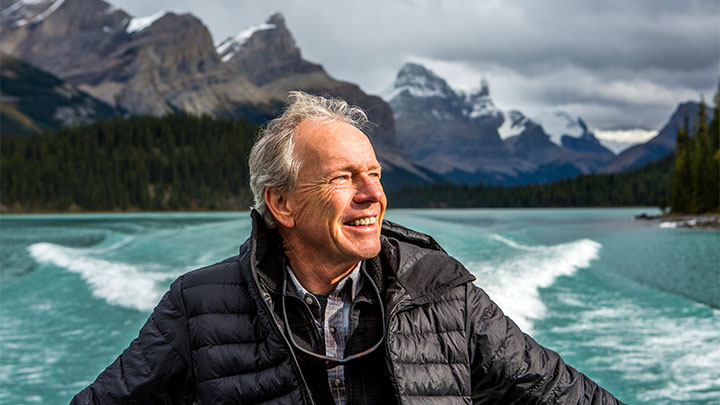 Happy older man on a boat