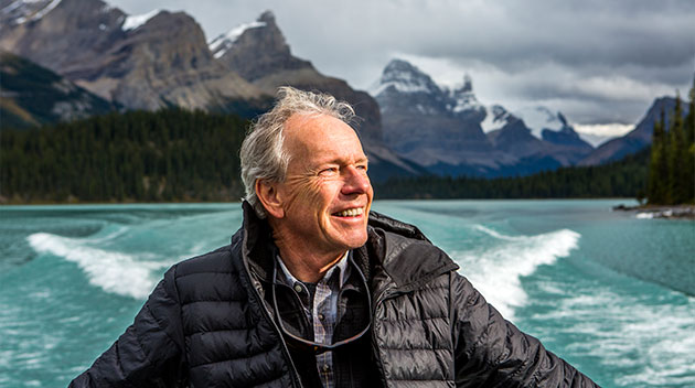 Happy older man on a boat