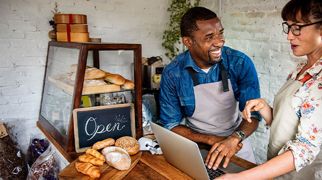 Two coffee shop owners discussing sales