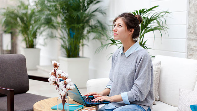 Woman sitting at her laptop