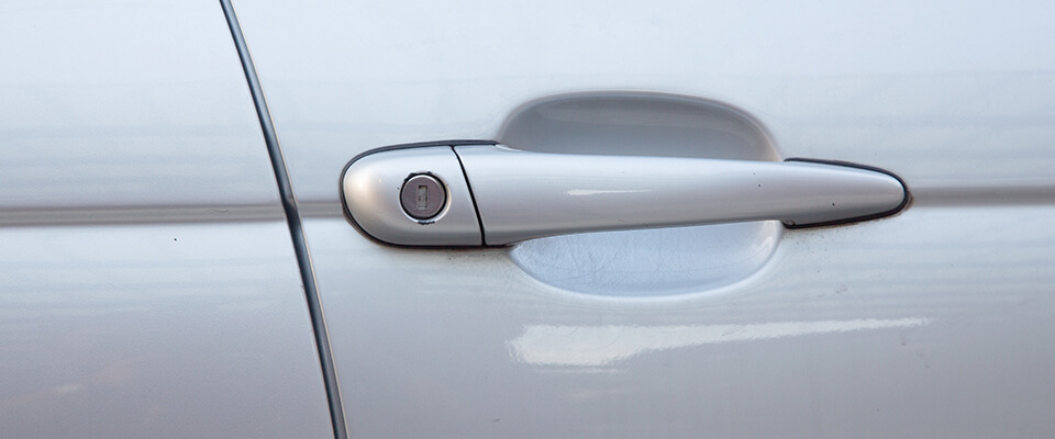 Close up of silver car door handle