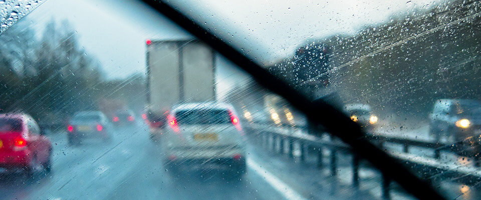 Rain on car windscreen from drivers perspective